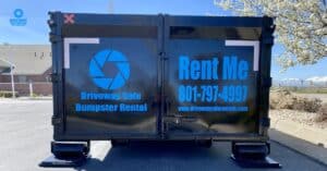 Roll-off dumpster ready for home cleanout in Davis County