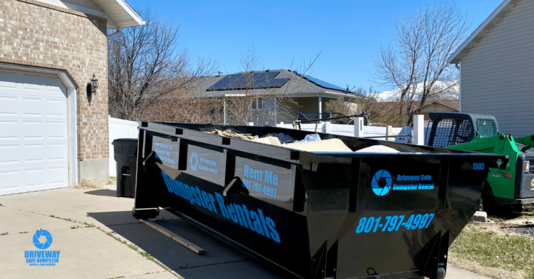 Residential roll off dumpster placed safely on a driveway in Utah