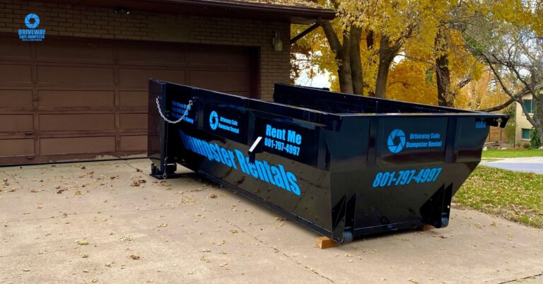 Roll off dumpster safely placed on a residential driveway in Utah