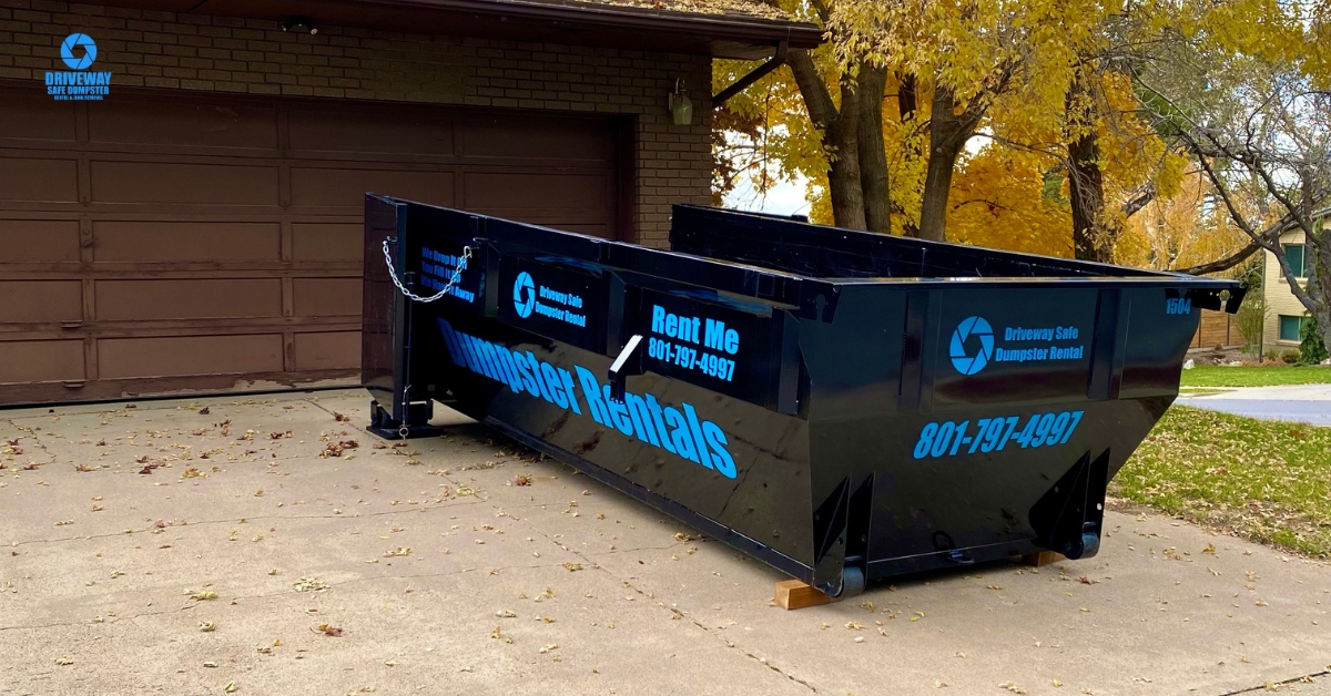 Roll off dumpster safely placed on a residential driveway in Utah
