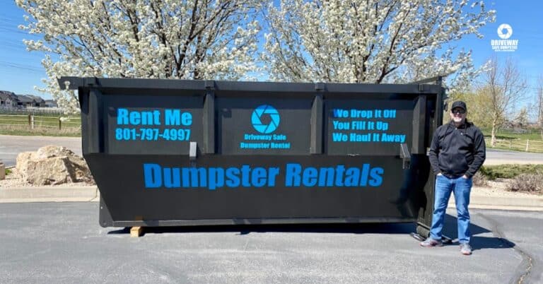 Roll off dumpster placed in a residential driveway during a renovation.