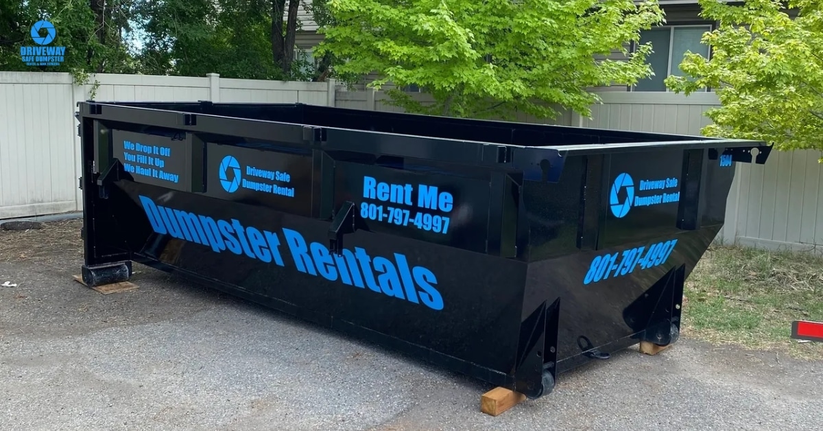 Roll-off dumpster safely placed in residential driveway