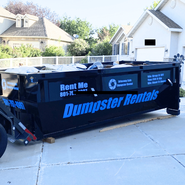 Junk and renovation debris piled up beside a home in Farmington UT