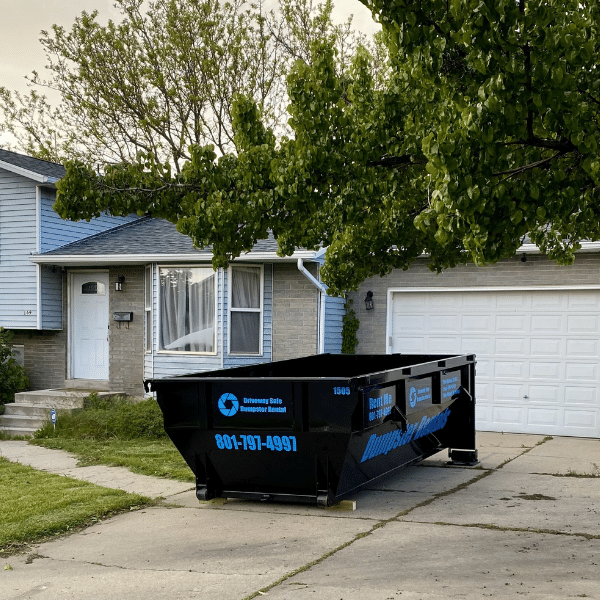 Homeowner checking rental time while using a dumpster.