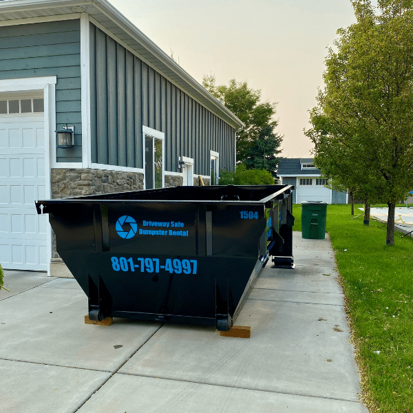 Open roll-off container filled with renovation debris